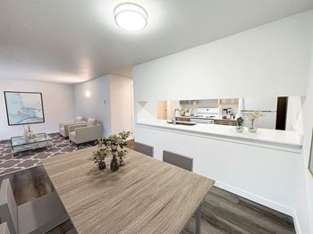 a living room and dining room with a table and a kitchen  at The Trail, Snohomish
